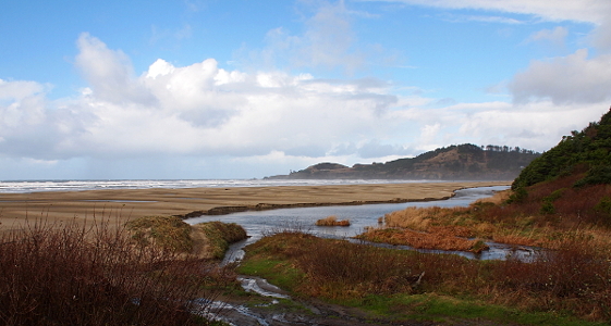 [A stretch of sand separates the creek from the ocean. At this place, the creek bends from perpendicular to parallel to the ocean.]